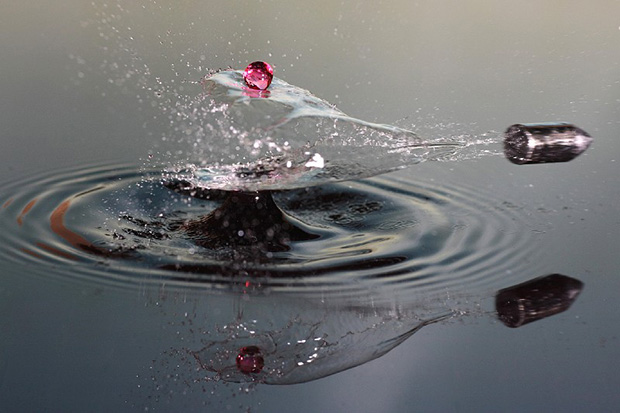 A bullet piercing through water
